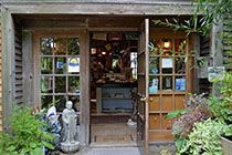 Store entrance with wood and glass.